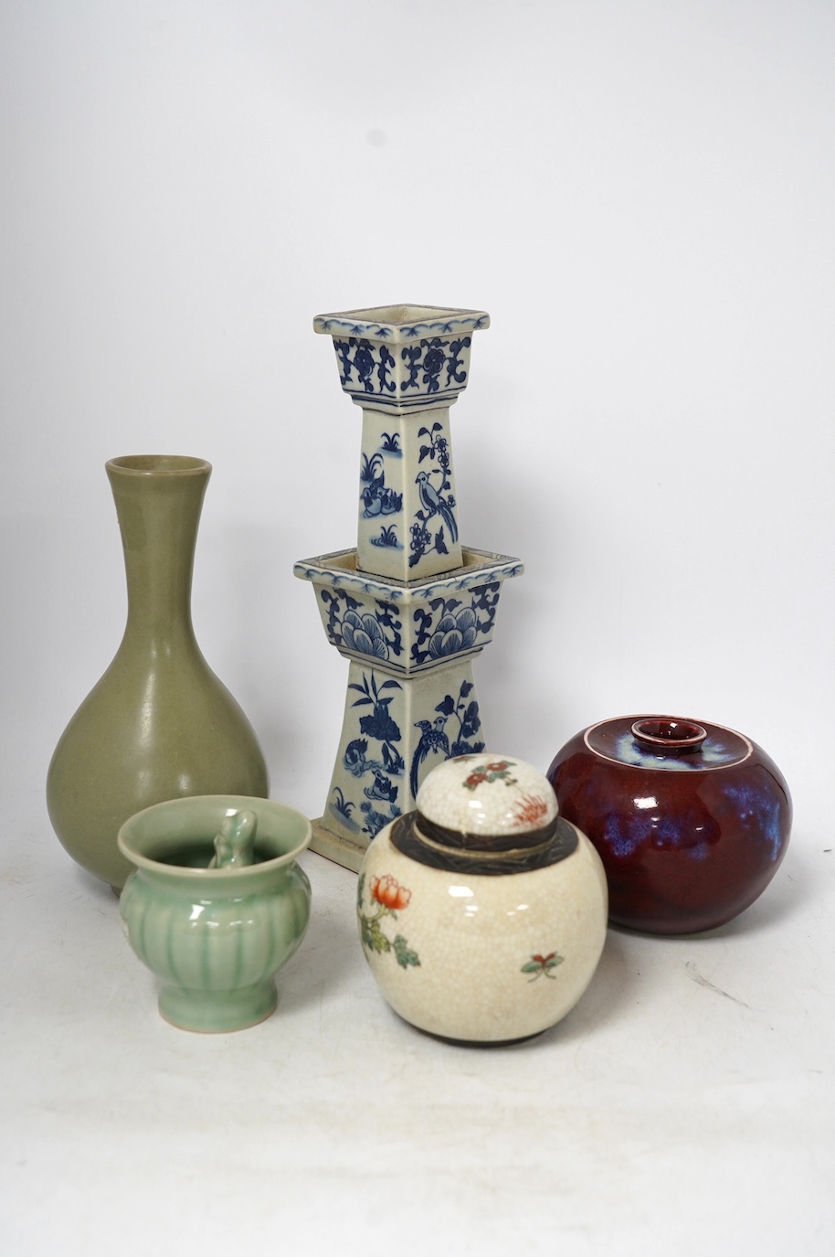 Chinese ceramics - a Celadon glazed vase, two jars and covers, a blue and white candlestick and a celadon pot, tallest 29cm (5). Condition - fair to good